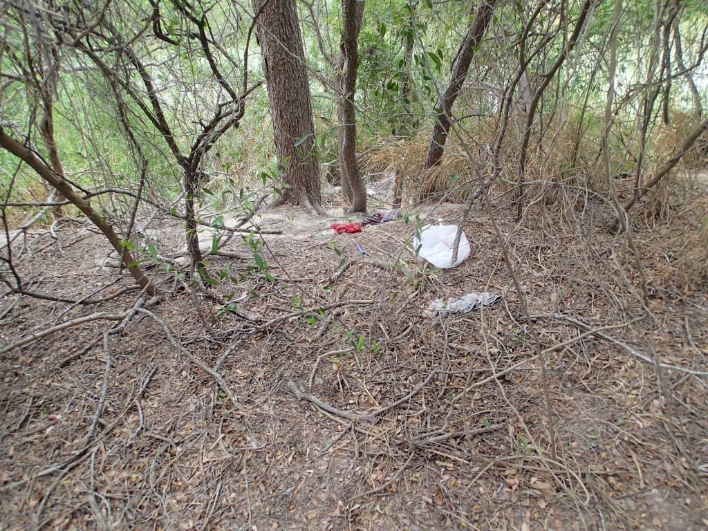 Discarded clothes and such possibly from someone swimming across the river 